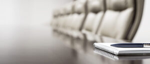 Notepad,on,table,in,empty,conference,room,with,copy,space